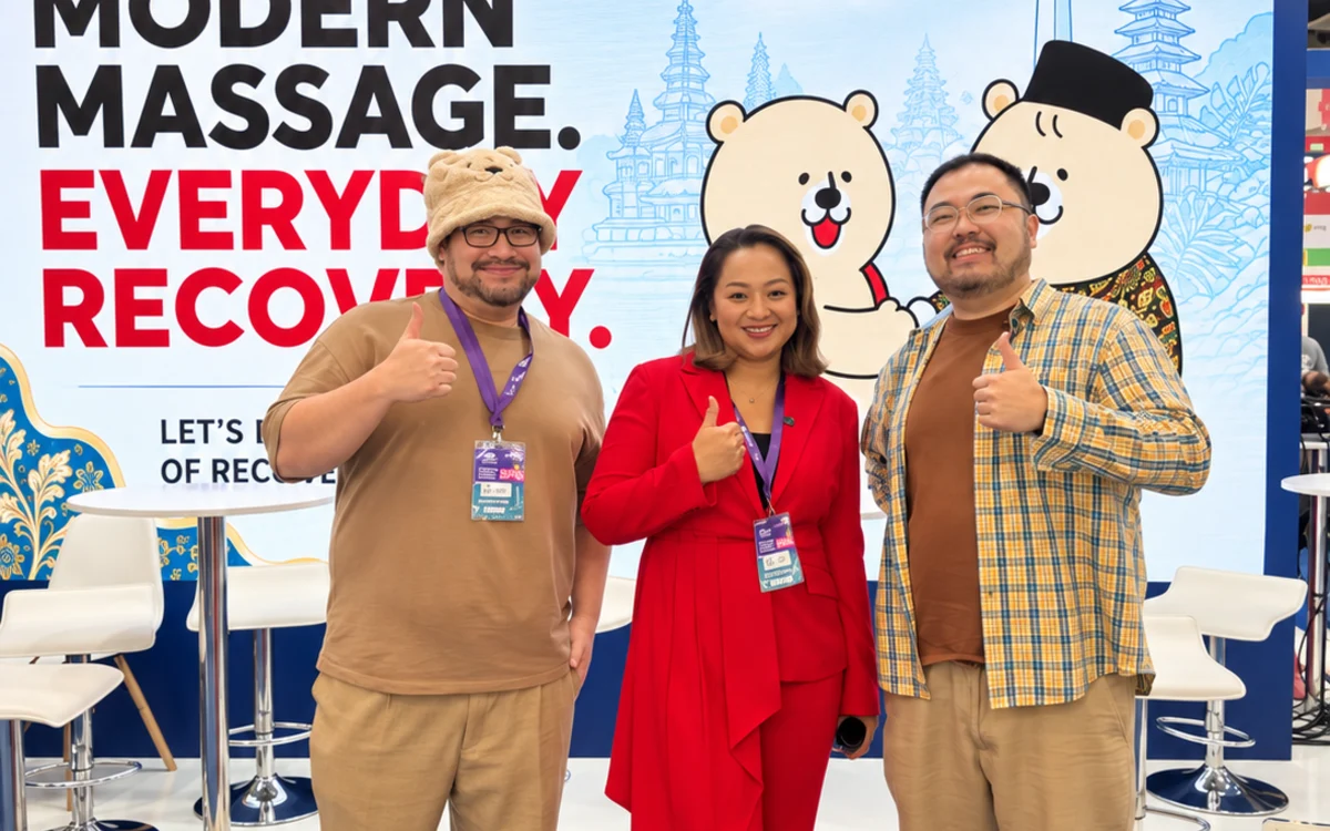 The Ojisan team standing together in front of an event booth